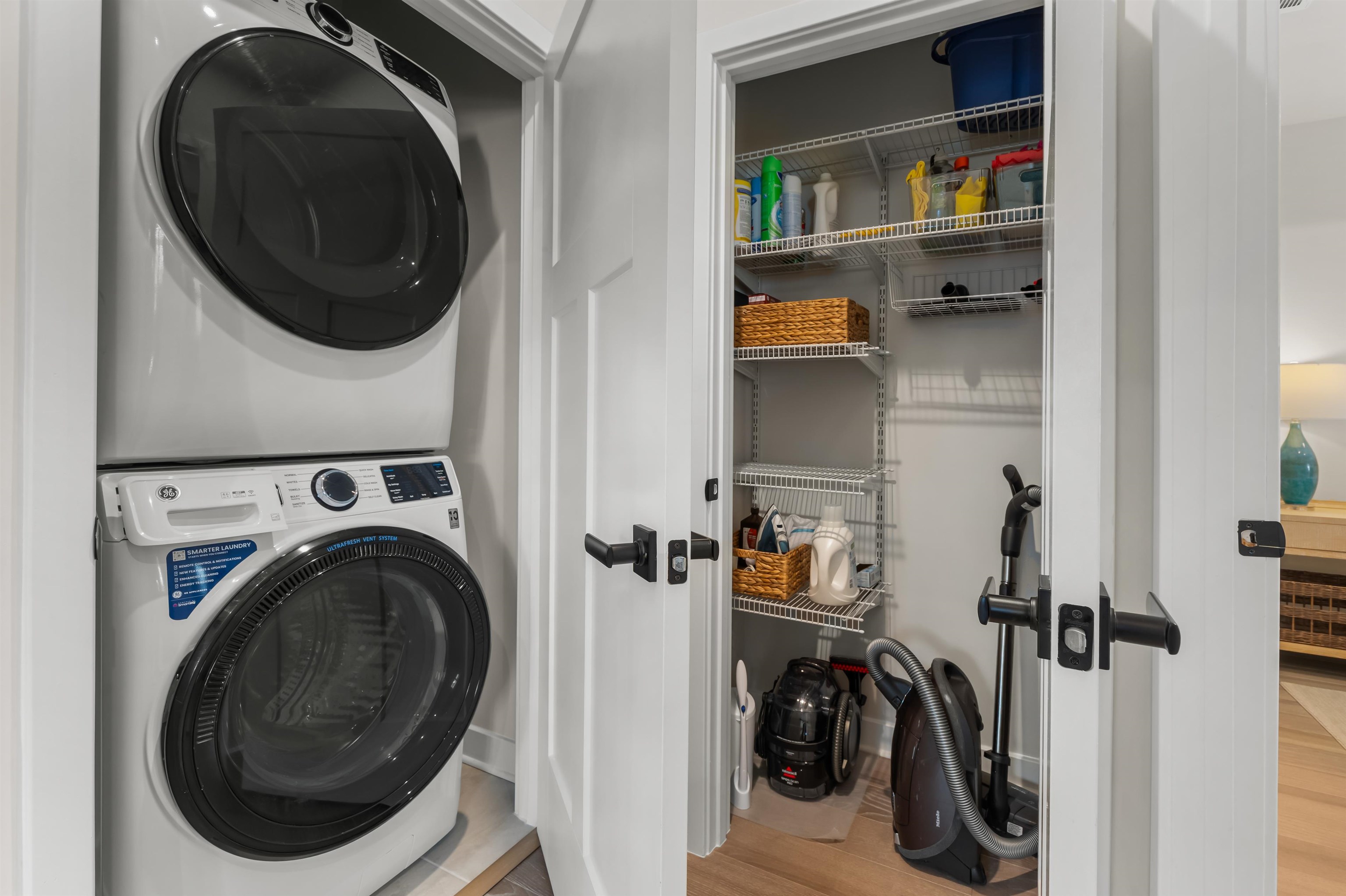 2519 Elowen Lane, Unit 9B Longs, SC 29568 - Photo 11 of 40 Laundry room with light wood-type flooring and stacked washer / dryer