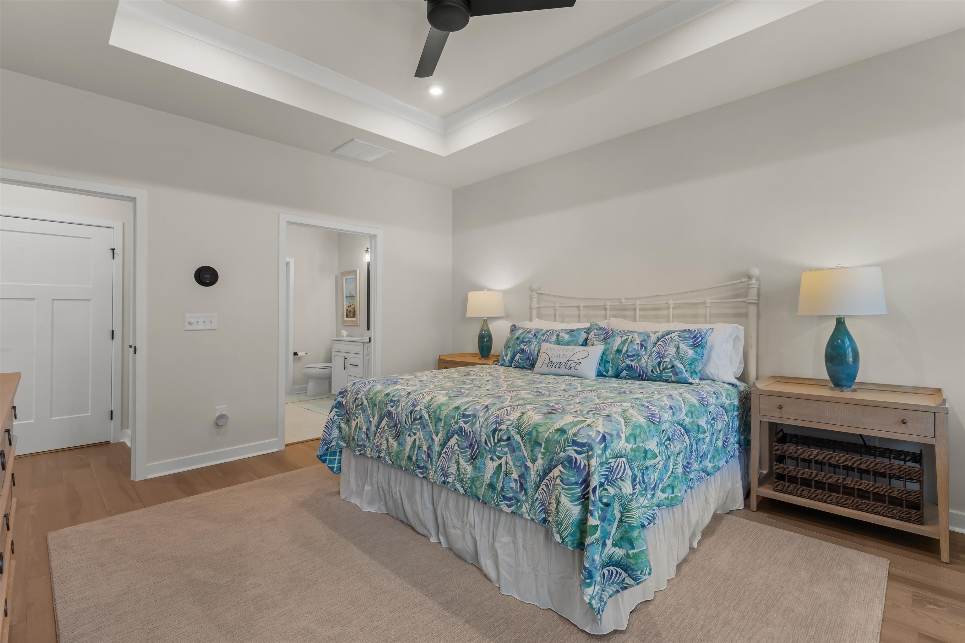 2519 Elowen Lane, Unit 9B Longs, SC 29568 - Photo 13 of 40 Bedroom with light wood-type flooring, a tray ceiling, ensuite bath, ceiling fan, and recessed lighting