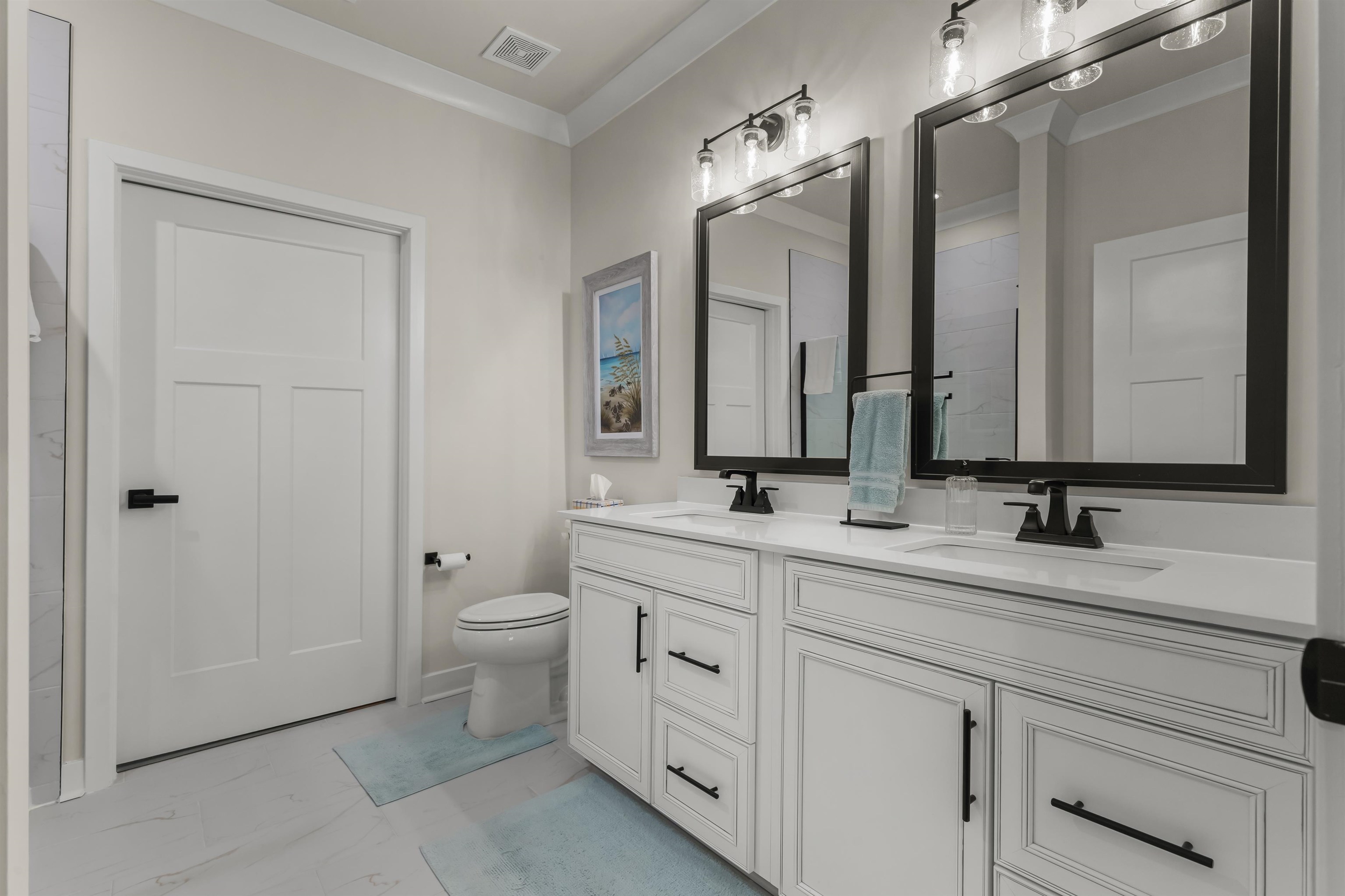 2519 Elowen Lane, Unit 9B Longs, SC 29568 - Photo 14 of 40 Full bath with ornamental molding, double vanity, and light marble finish flooring