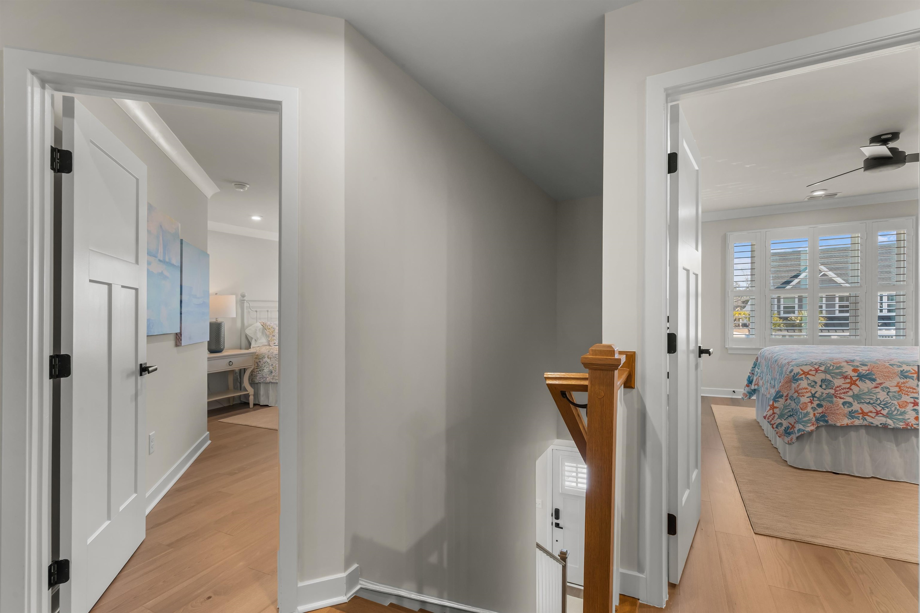 2519 Elowen Lane, Unit 9B Longs, SC 29568 - Photo 22 of 40 Corridor with ornamental molding, light wood-style flooring, and an upstairs landing