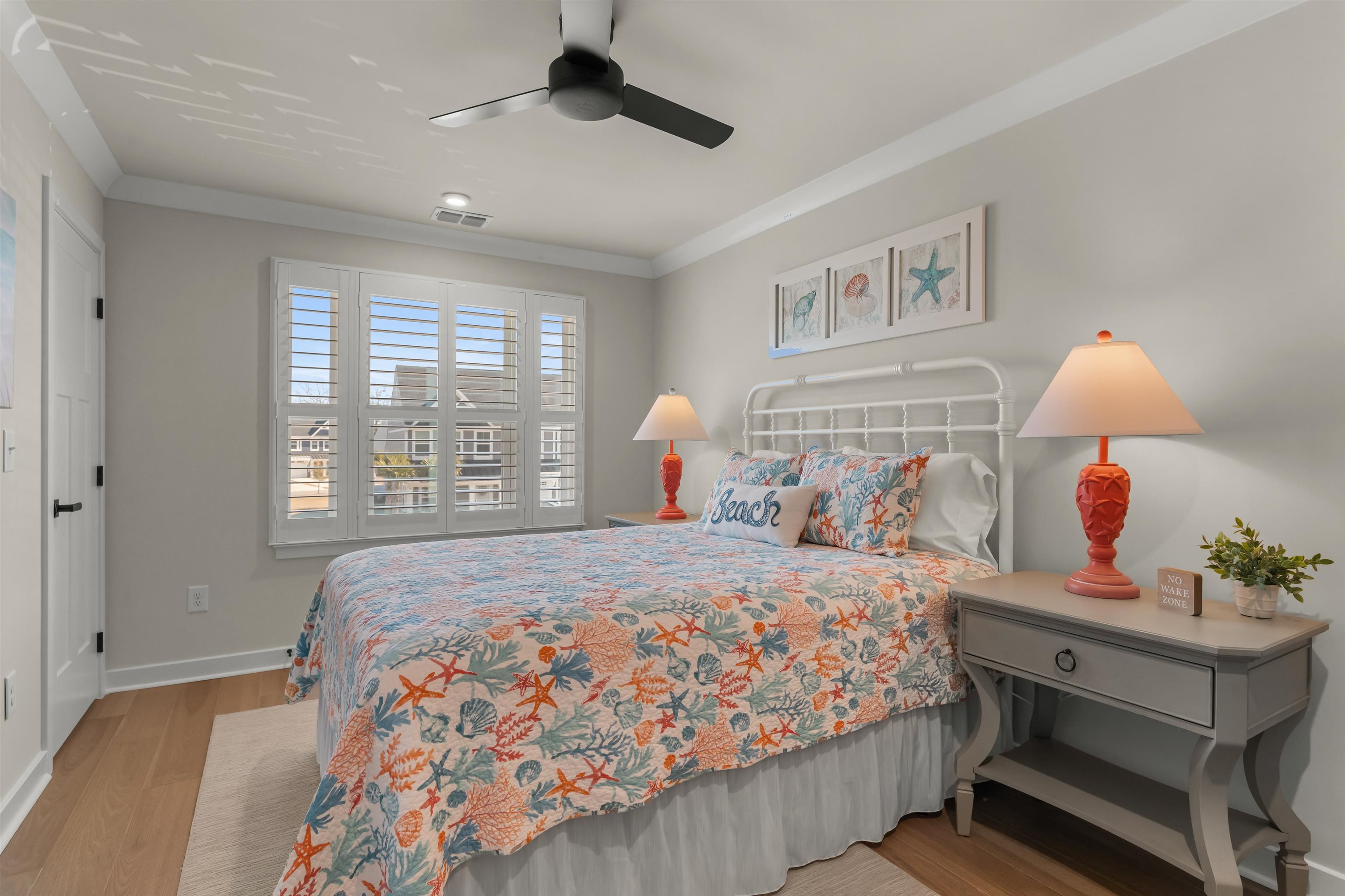 2519 Elowen Lane, Unit 9B Longs, SC 29568 - Photo 24 of 40 Bedroom featuring ornamental molding, light wood-type flooring, and ceiling fan