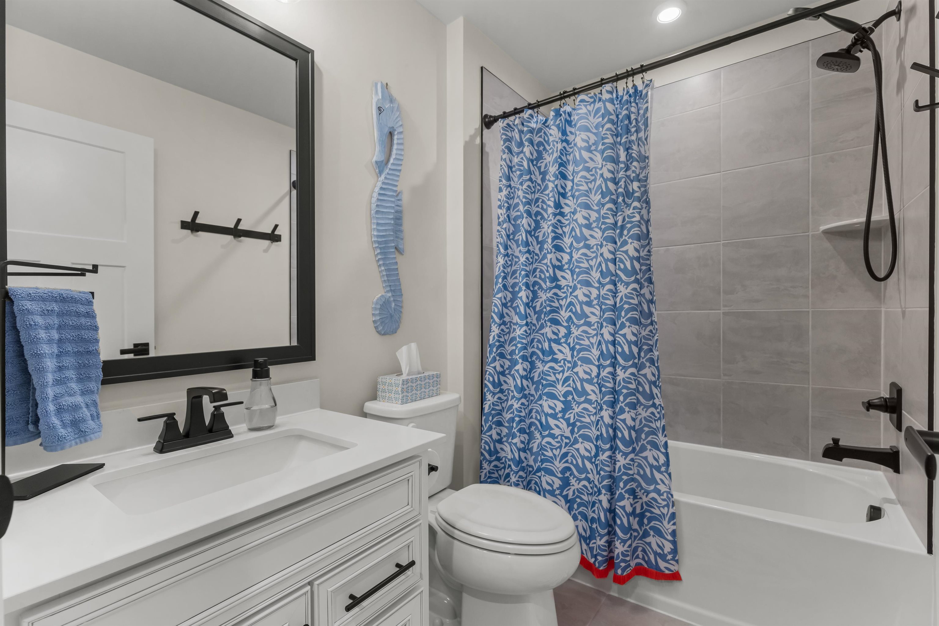 2519 Elowen Lane, Unit 9B Longs, SC 29568 - Photo 27 of 40 Bathroom with vanity, shower / bath combination with curtain, and tile patterned flooring