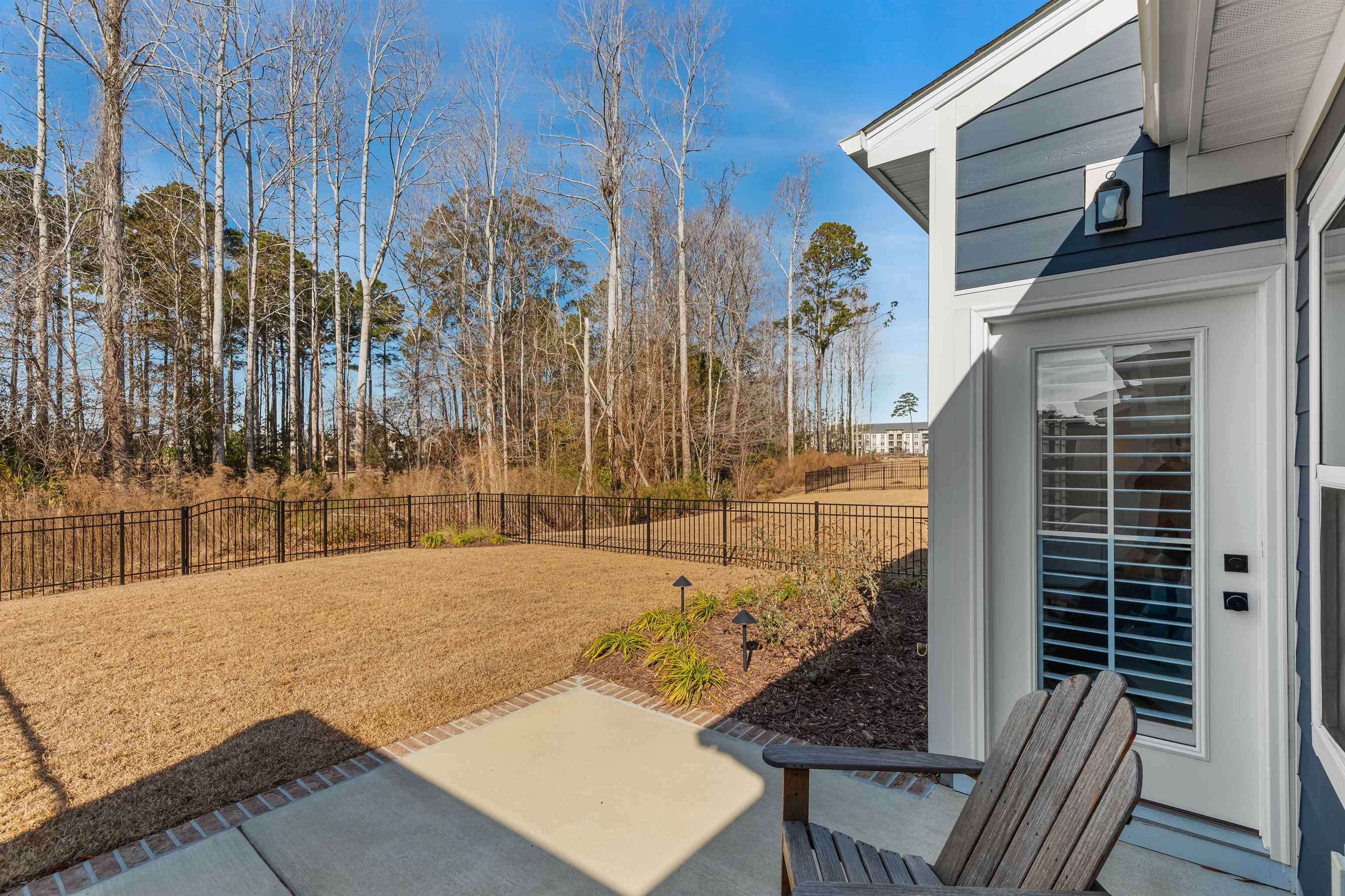 2519 Elowen Lane, Unit 9B Longs, SC 29568 - Photo 33 of 40 Fenced backyard with a patio area