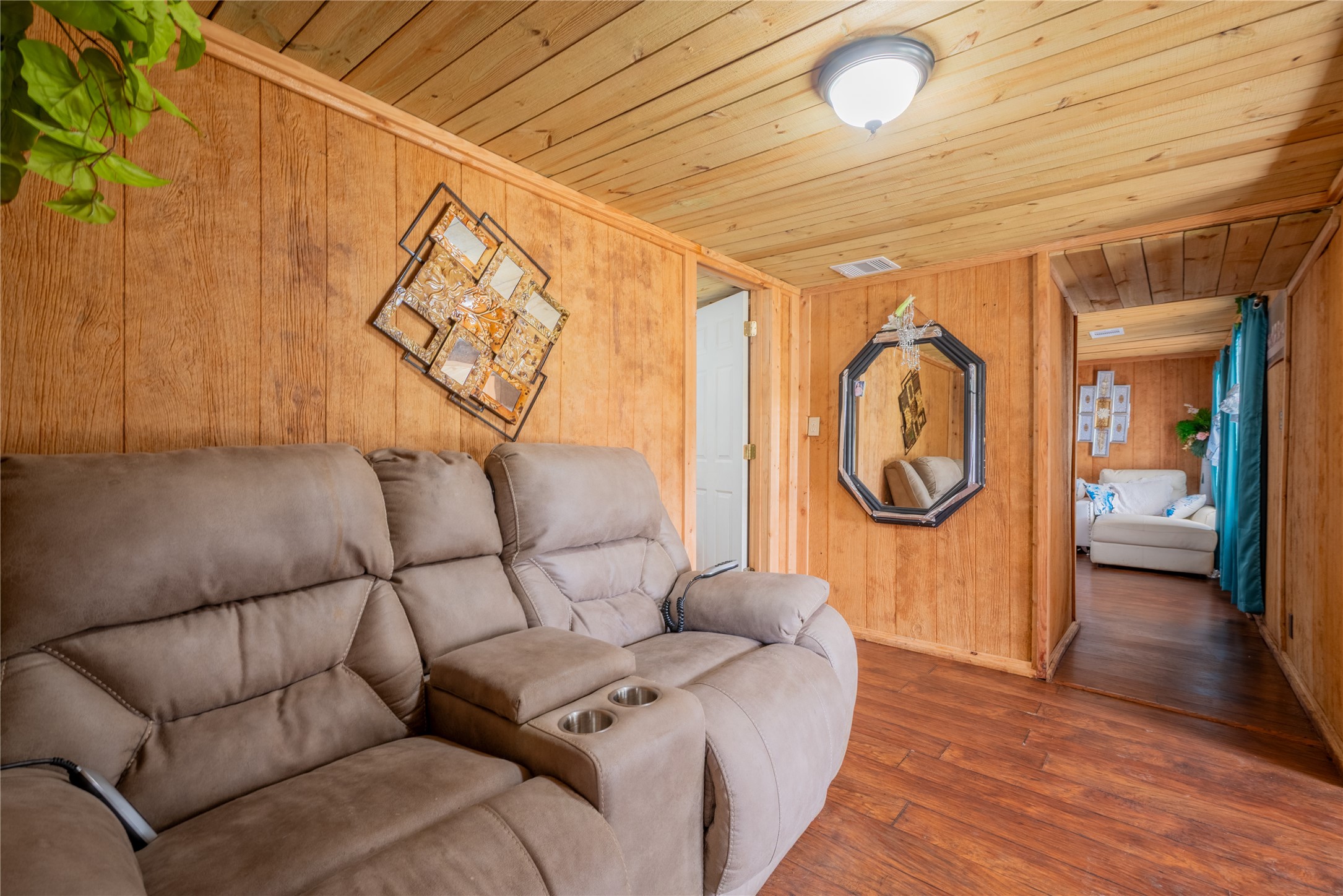 299 Mack Foster Street Winnie, TX 77665 - Photo 12 of 34 a living room with furniture and a wooden floor