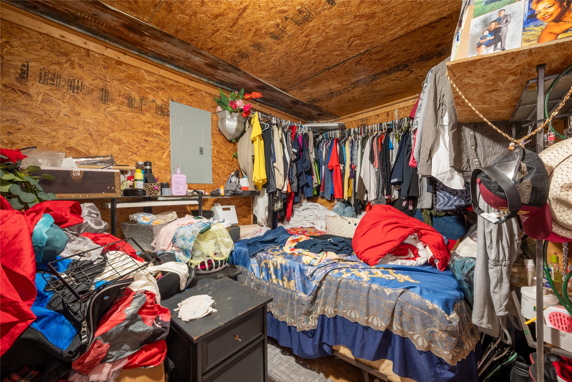 299 Mack Foster Street Winnie, TX 77665 - Photo 20 of 34 a view of walk in closet with clothes and shoes