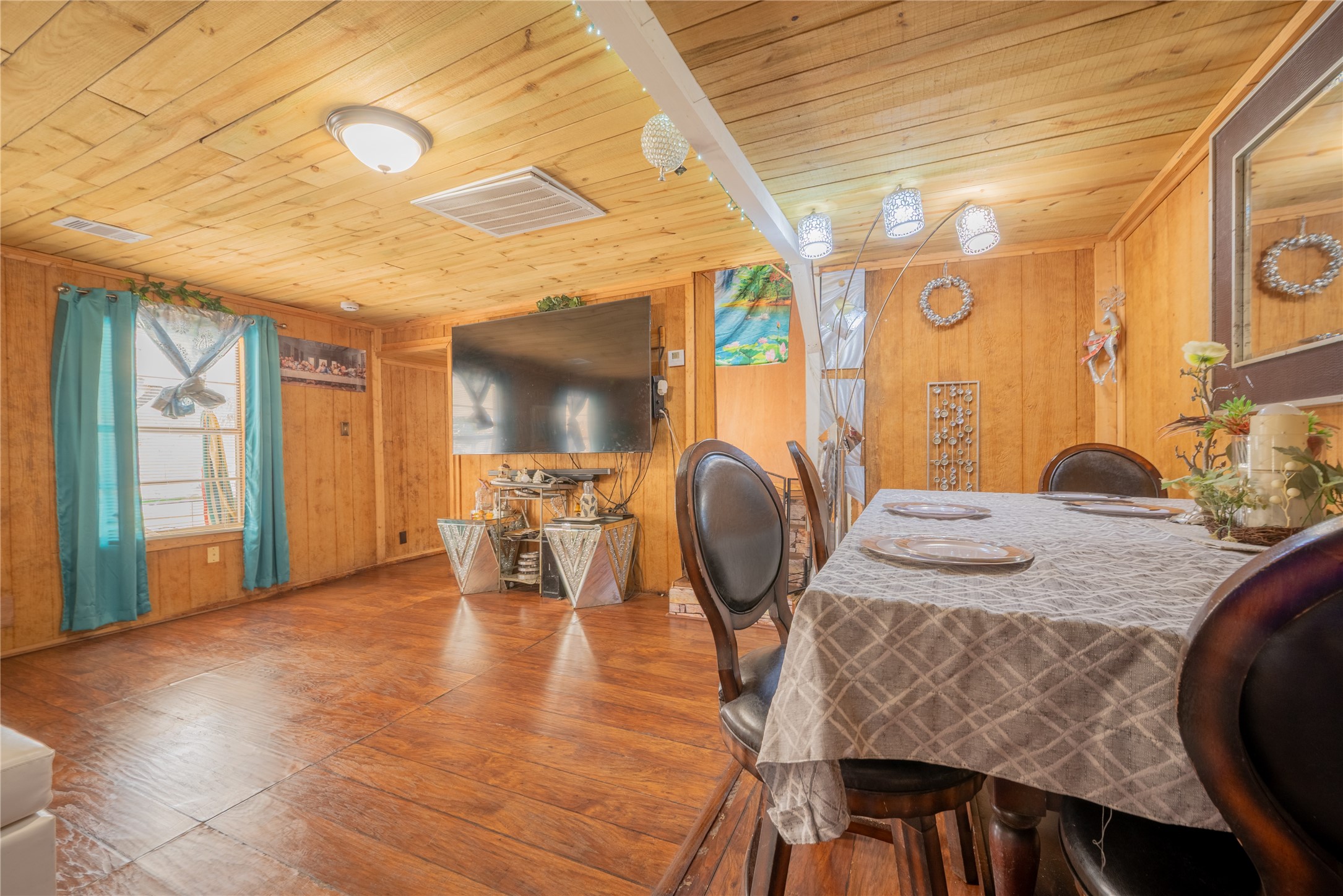 299 Mack Foster Street Winnie, TX 77665 - Photo 22 of 34 a view of a dining room with furniture and wooden floor