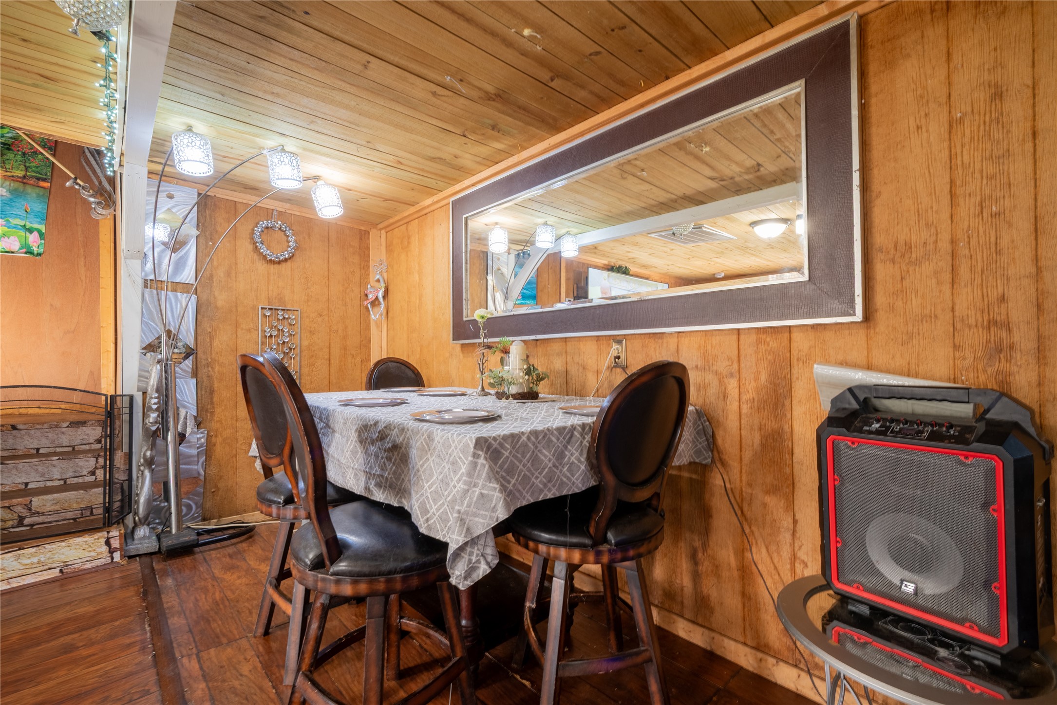 299 Mack Foster Street Winnie, TX 77665 - Photo 27 of 34 a view of a dining room with furniture and wooden floor