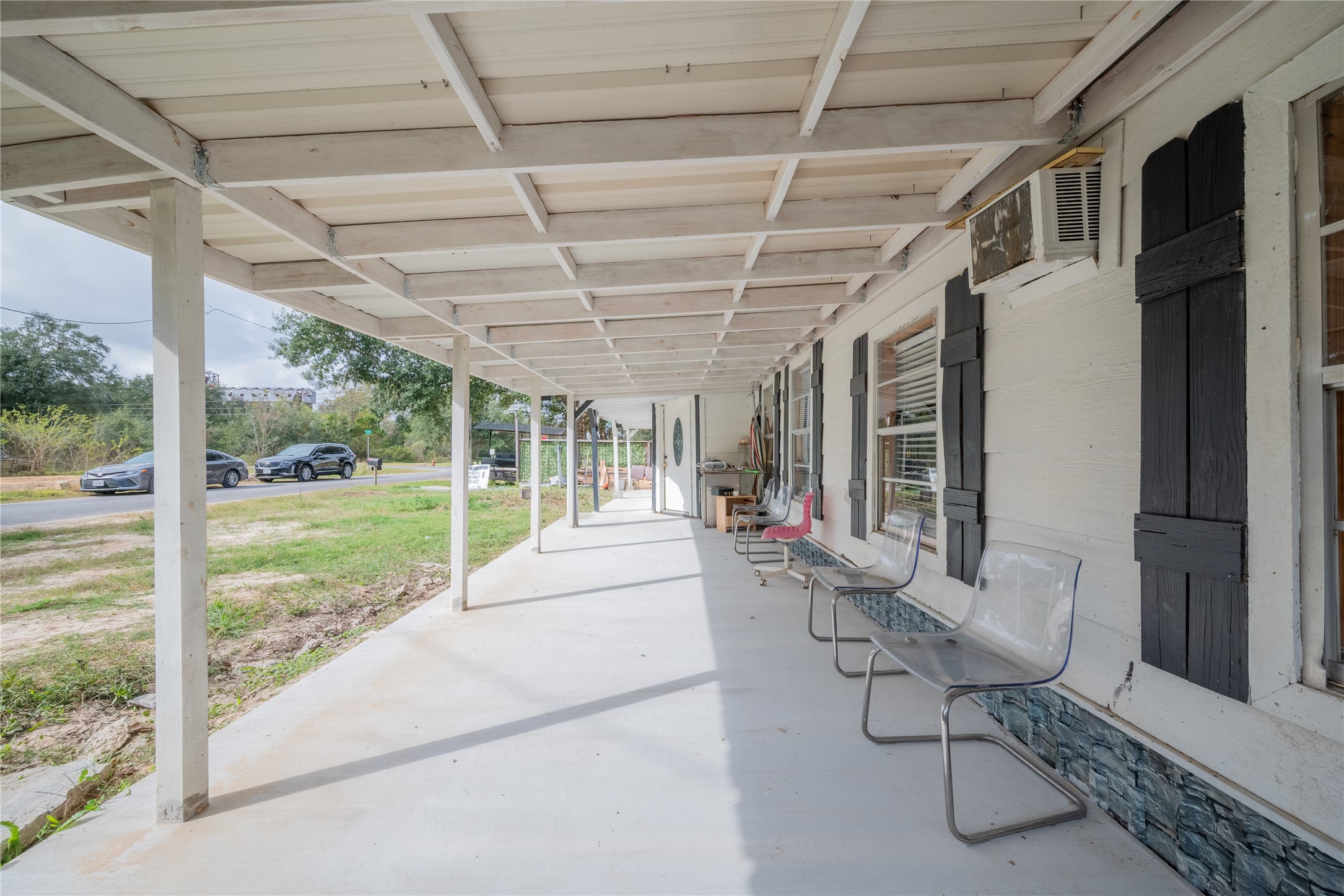 299 Mack Foster Street Winnie, TX 77665 - Photo 6 of 34 a building outdoor space with patio furniture and potted plants