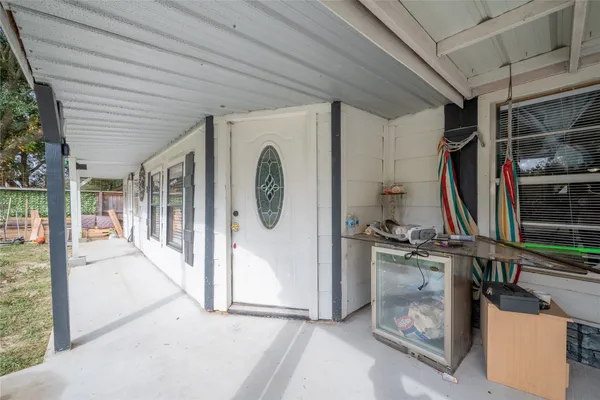 a view of an entryway with wooden floor