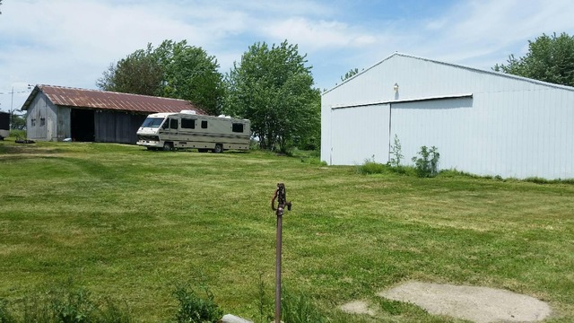 3466 Cyclone Road Earlville, IL 60518 - Photo 4 of 8 a front view of a house with a yard