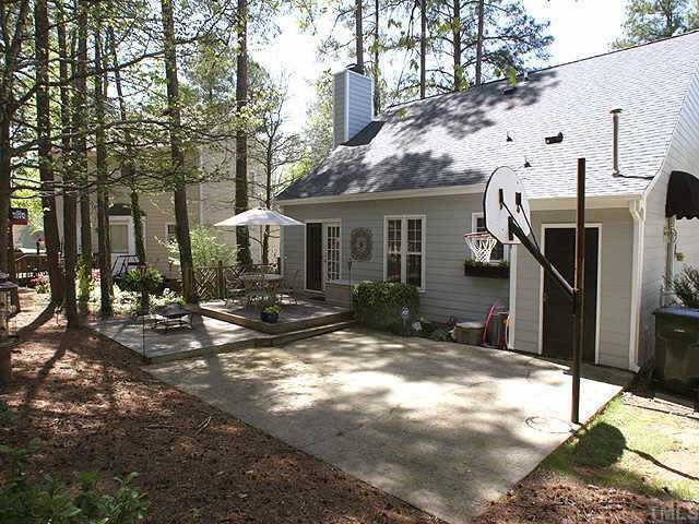 6916 Sandringham Drive Raleigh, NC 27613 - Photo 8 of 8 a view of a house with backyard
