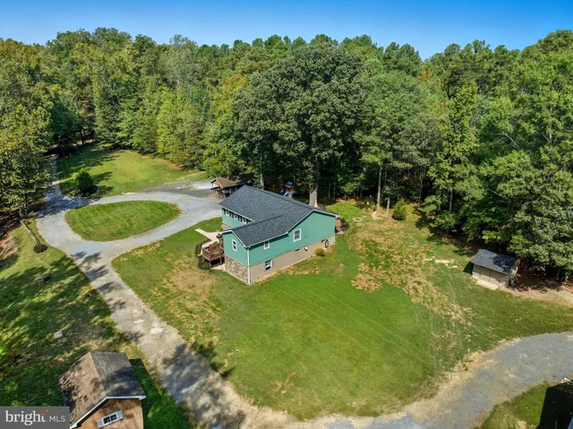 a view of a swimming pool with a yard