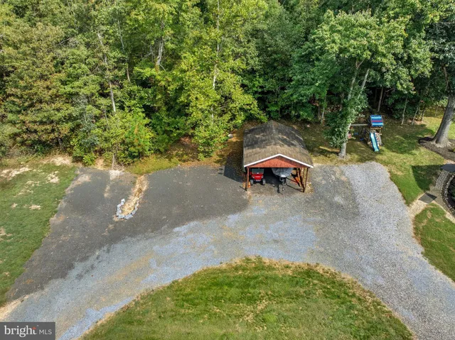 a backyard of a house with yard and outdoor seating