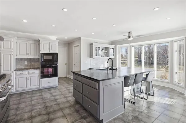 $695,000 | 12313 Pembroke Lane, Leawood, KS 66209