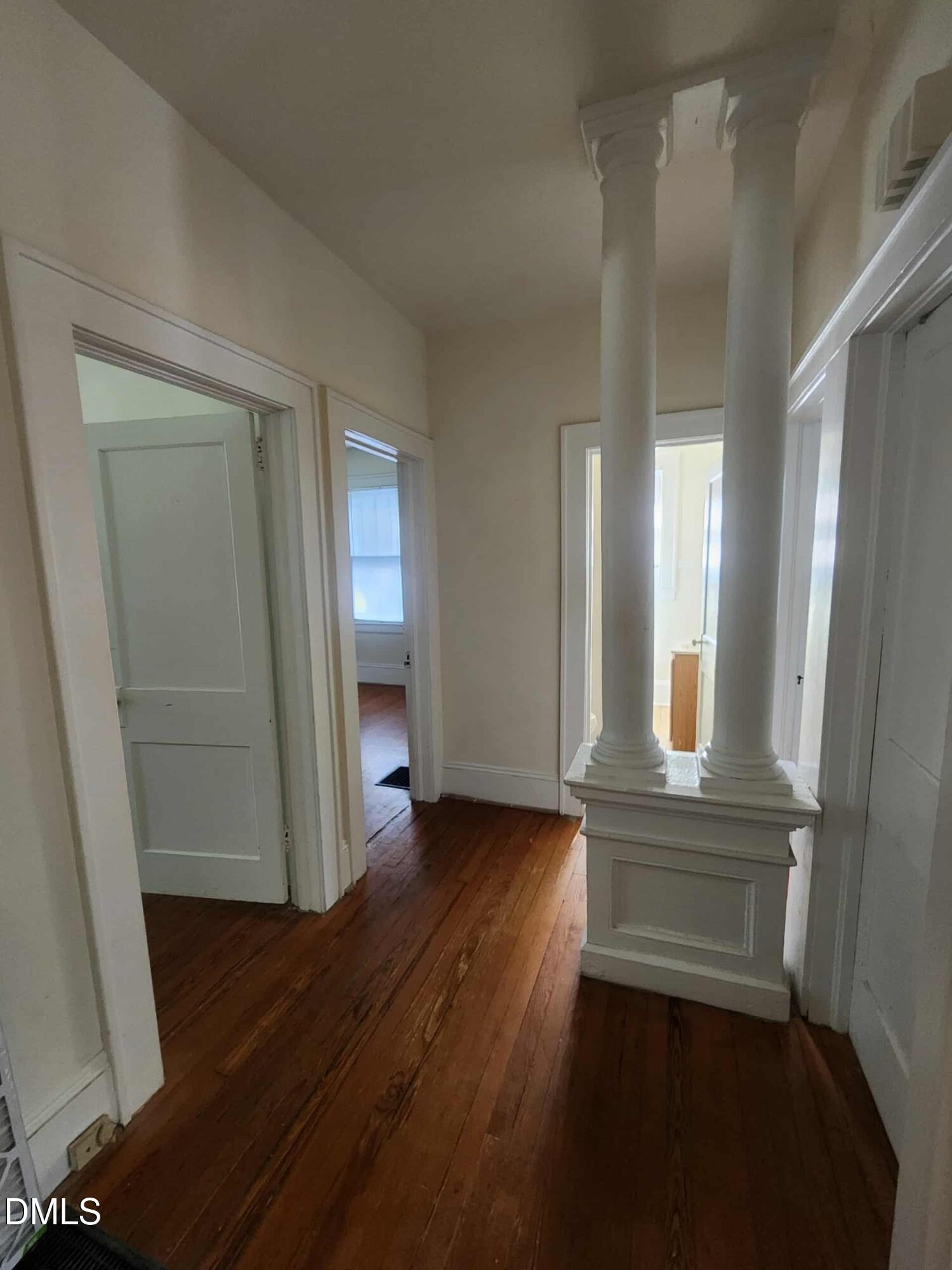 308 East Whitaker Mill Road Raleigh, NC 27608 - Photo 7 of 7 wooden floor in an empty room with a mirror