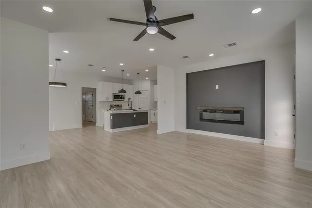 a view of kitchen with a sink and a stove top oven