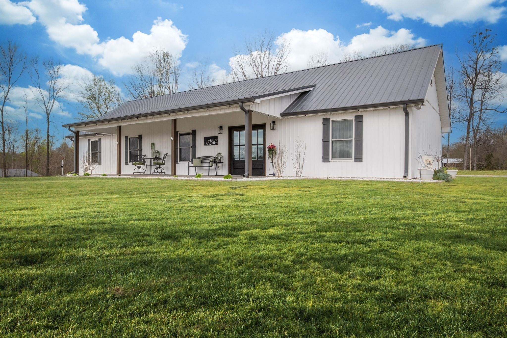 1043 Murphy Hollow Road Vanleer, TN 37181 - Photo 56 of 68 a house view with a sitting space and garden view