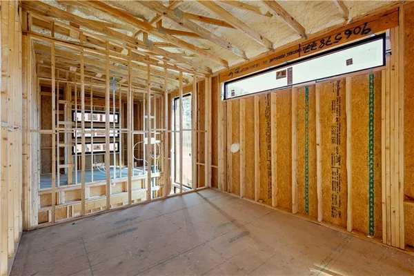 a view of an empty room with windows
