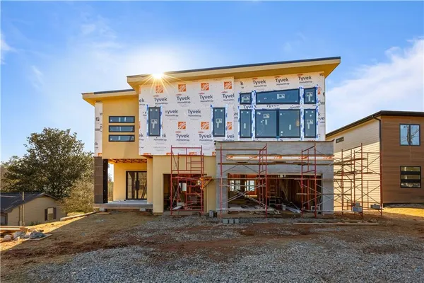 a view of house with outdoor space and porch