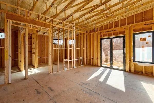 a view of a building with a wooden fence