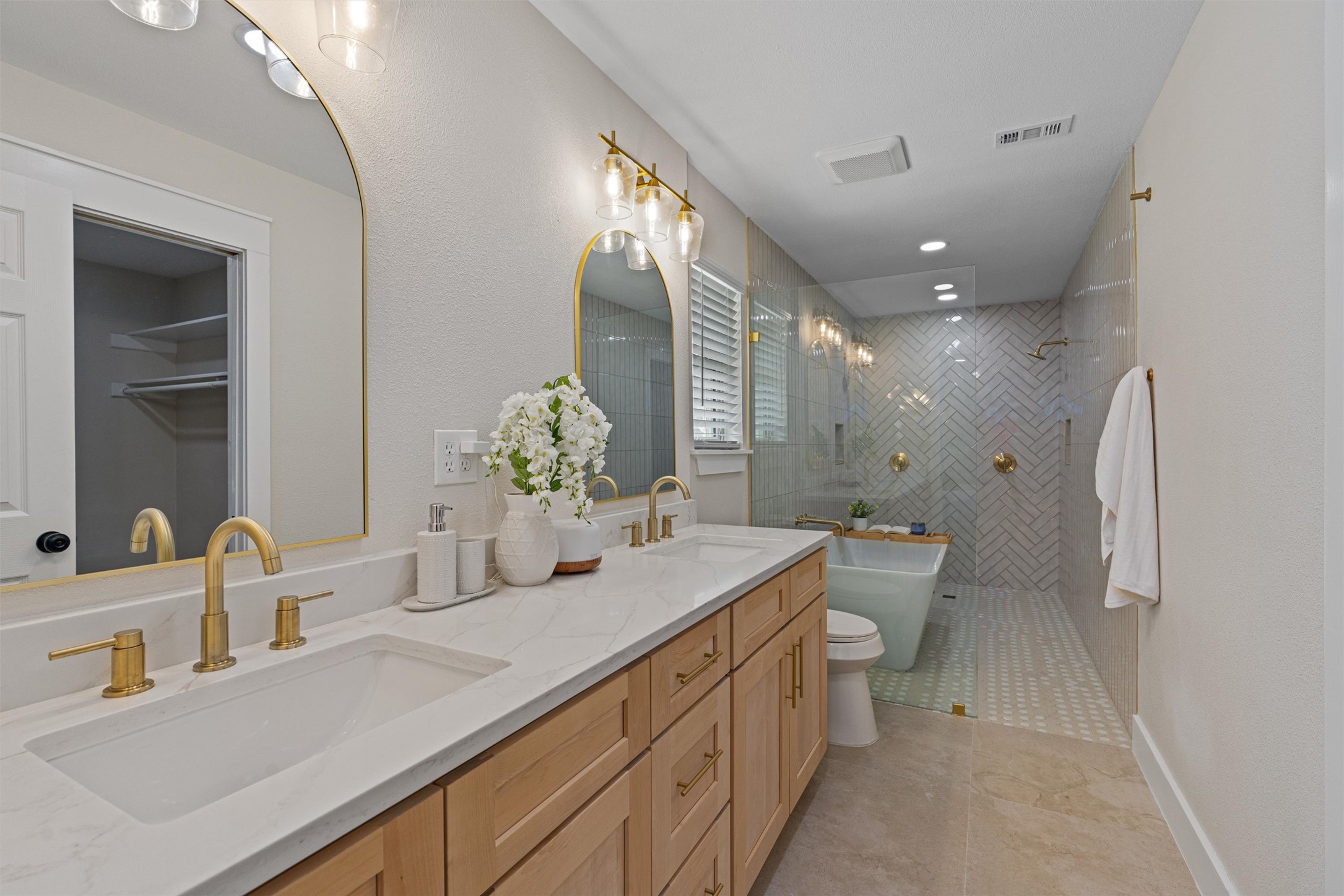 224 Clear Spring Road Georgetown, TX 78628 - Photo 23 of 40 a bathroom with a double vanity sink toilet and a mirror