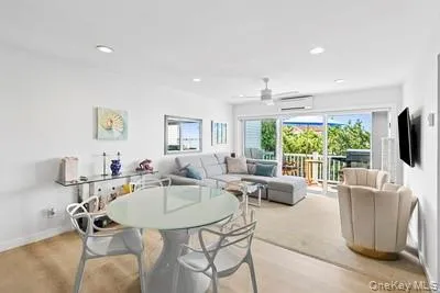 a dining room with furniture a window and a kitchen view