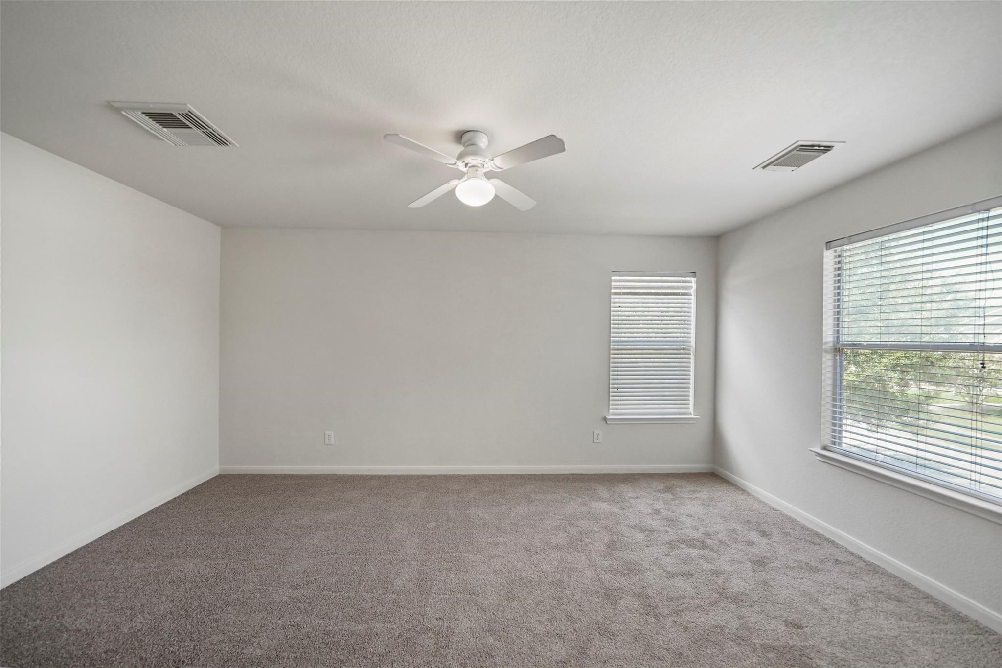 3610 Avalon Castle Drive Spring, TX 77386 - Photo 11 of 23 wooden floor in an empty room with a window