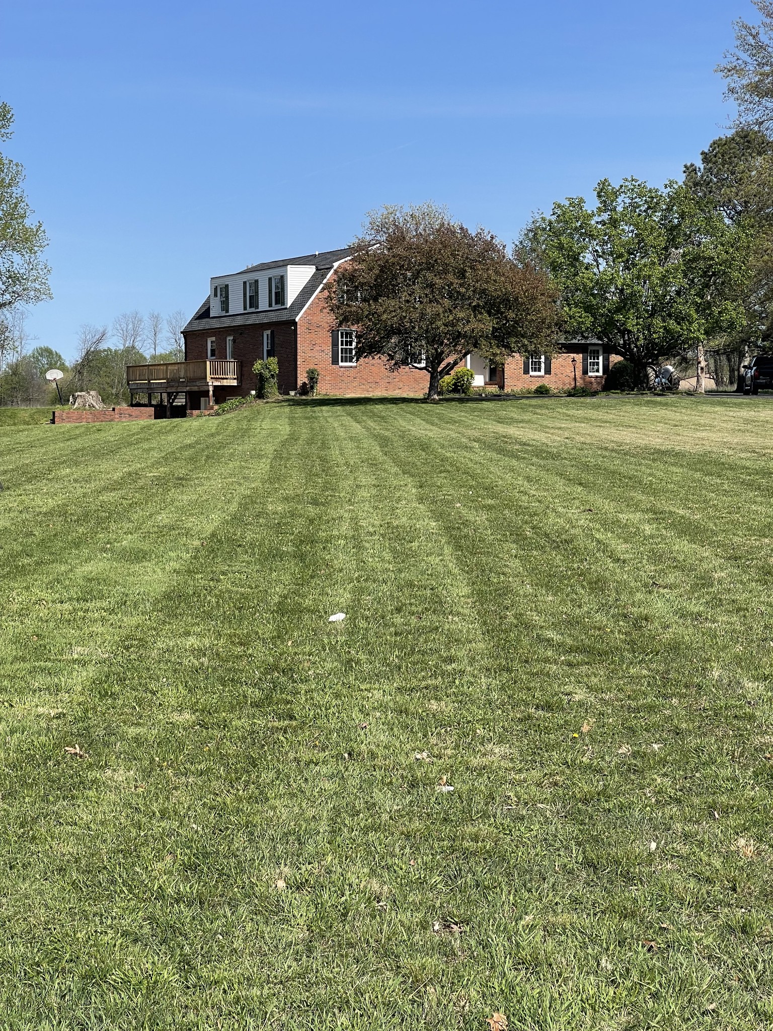 912 Long Creek Road Lafayette, TN 37083 - Photo 3 of 21 a view of a house with a big yard and large trees