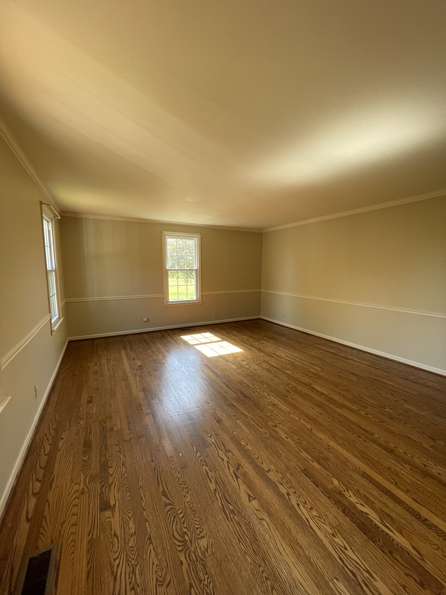 912 Long Creek Road Lafayette, TN 37083 - Photo 9 of 21 an empty room with wooden floor and windows