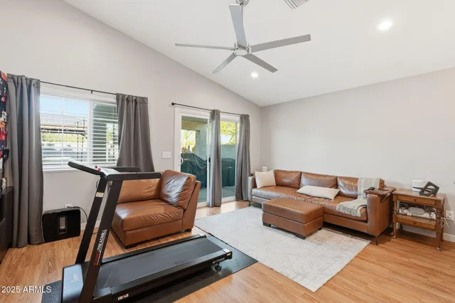 a living room with furniture and a window