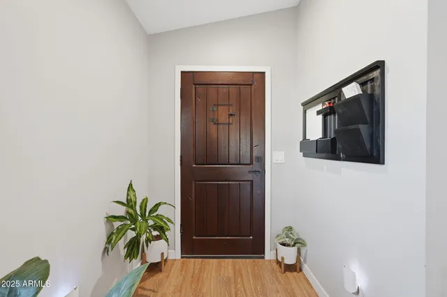 a view of front door with wooden floor