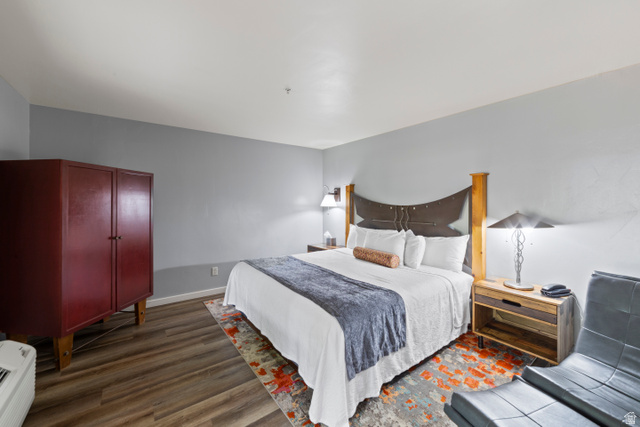 100 West 200 South, Unit 118 Moab, UT 84532 - Photo 19 of 39 Bedroom with dark wood finished floors and baseboards