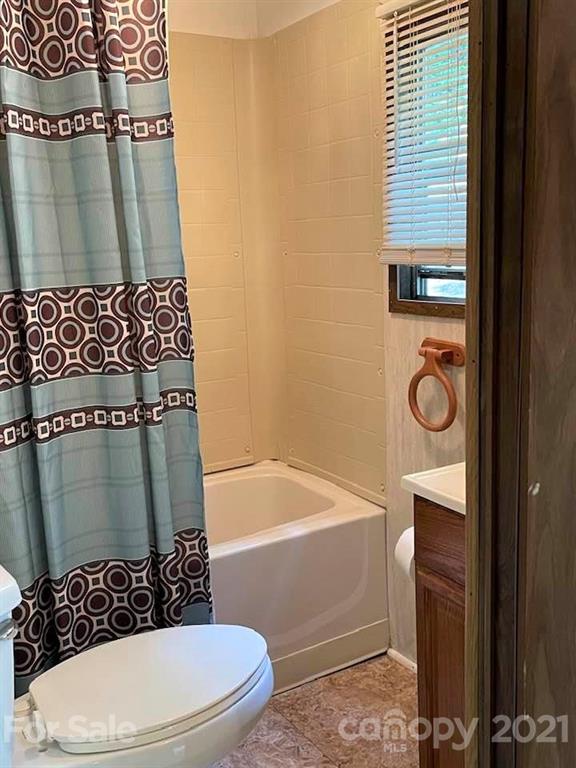 1730 Judes Gap Road, Unit 29 Mill Spring, NC 28756 - Photo 11 of 33 a bathroom with a toilet and a shower
