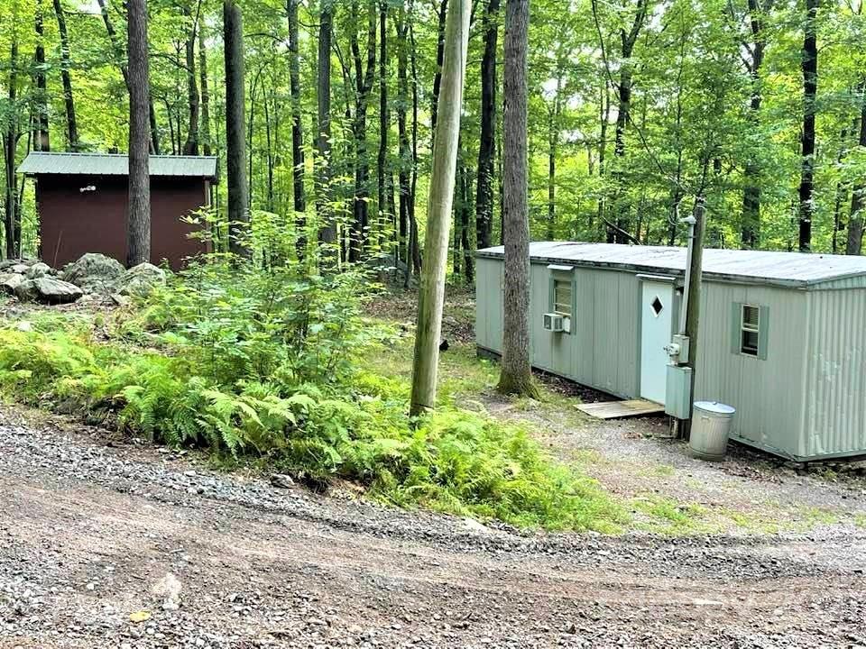 1730 Judes Gap Road, Unit 29 Mill Spring, NC 28756 - Photo 17 of 33 a view of a backyard