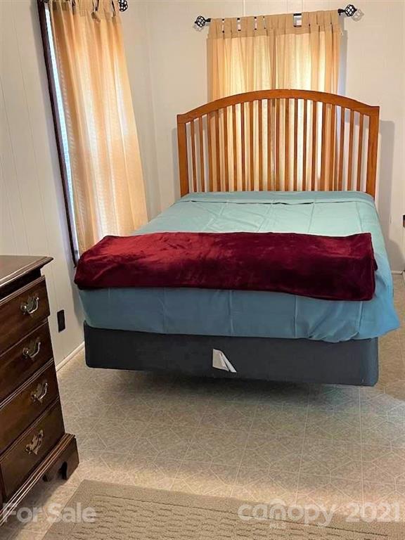 1730 Judes Gap Road, Unit 29 Mill Spring, NC 28756 - Photo 5 of 33 a bedroom with a bed and a window