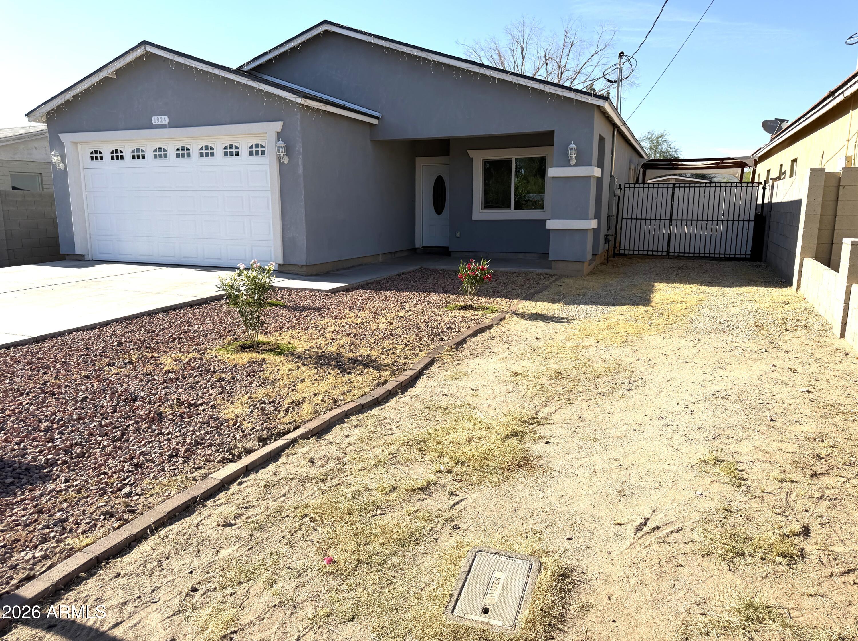 1924 West Lawrence Road Phoenix, AZ 85021 - Photo 2 of 17 a view of a house with a yard