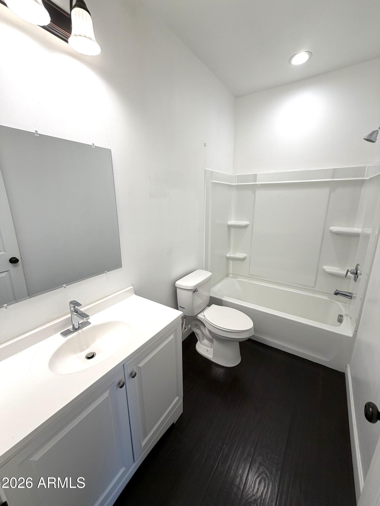 1924 West Lawrence Road Phoenix, AZ 85021 - Photo 7 of 17 a bathroom with a sink a toilet and shower