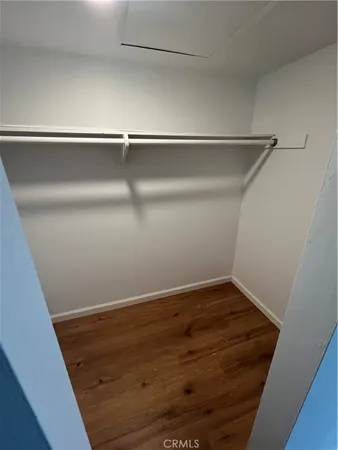 a view of a brick building next to a yard