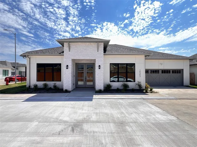 a view of a house with a garage