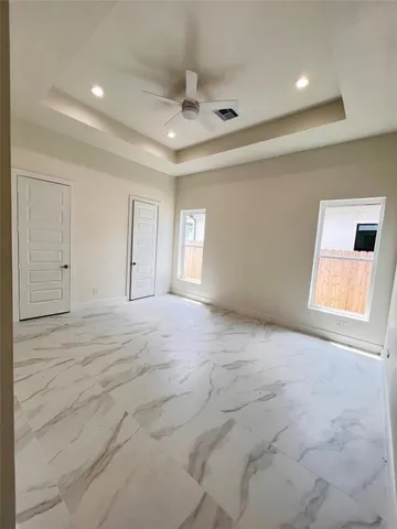 a bathroom with a shower and toilet
