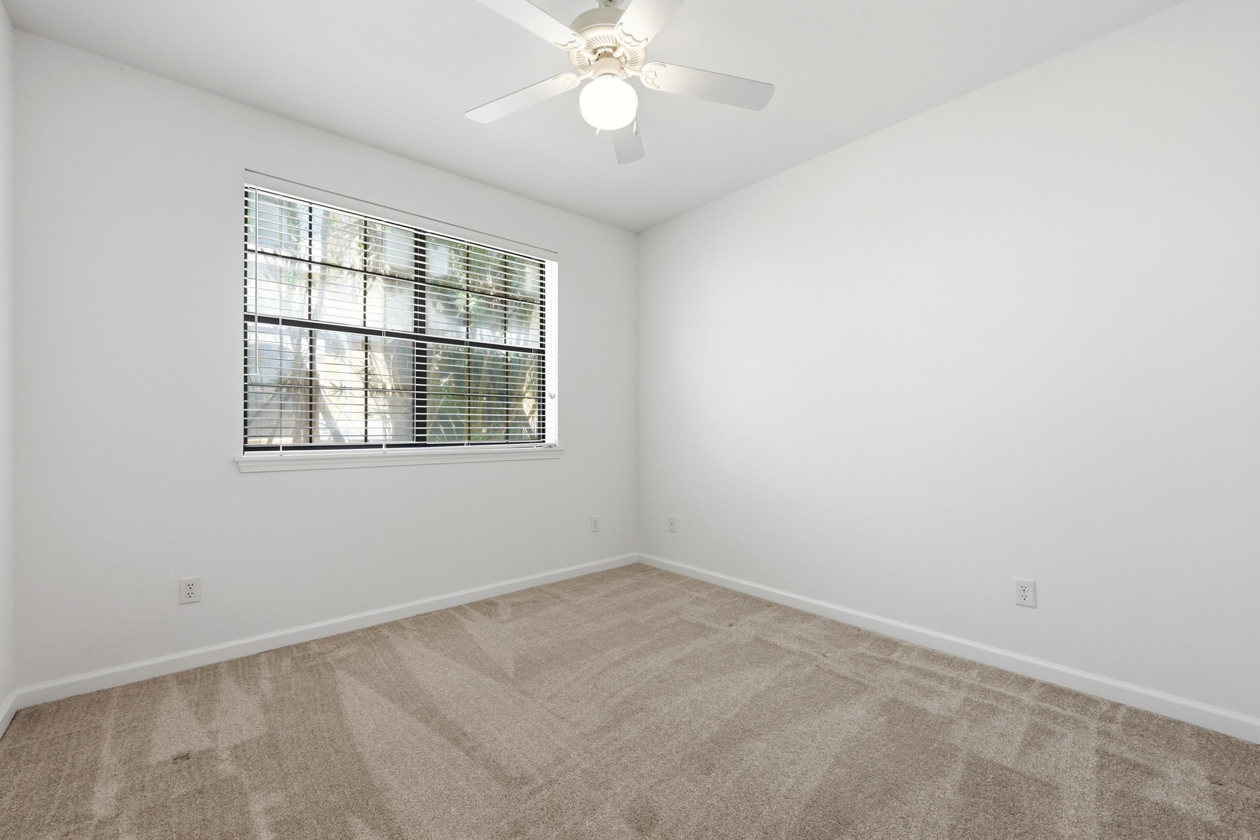 2500 Vista Cove Road St. Augustine, FL 32084 - Photo 34 of 53 an empty room with a window and a fan