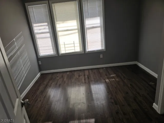 a bathroom with a granite countertop toilet a sink and bathtub