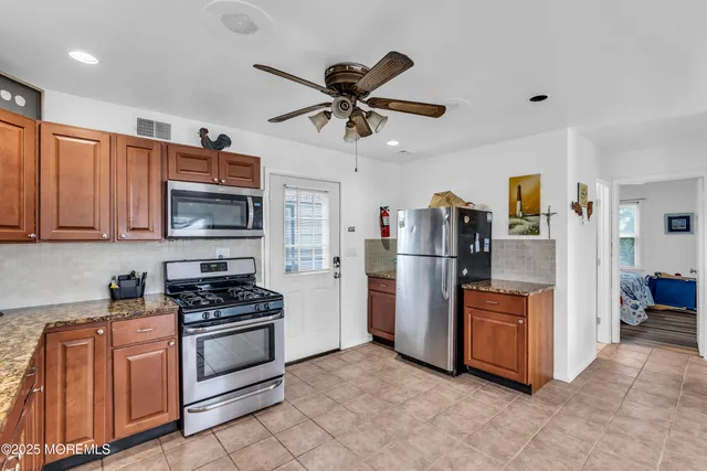 a work room with furniture and stairs