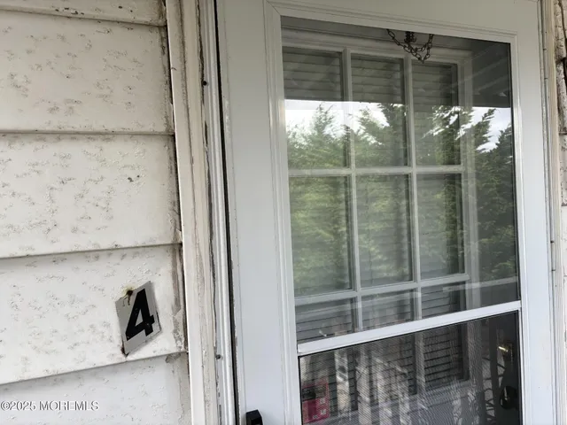 a bedroom with bed and flat screen tv