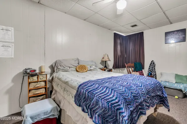 a bedroom with a bed and a table in it