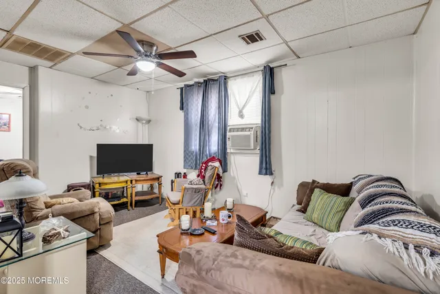 a kitchen with cabinets appliances a sink and a window