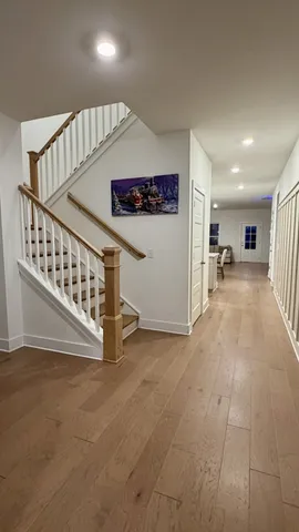 a view of staircase with white walls and windows
