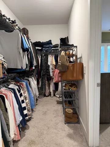 a spacious bathroom with a double vanity sink and a mirror