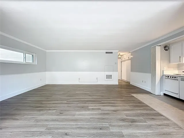 a view of a livingroom with wooden floor