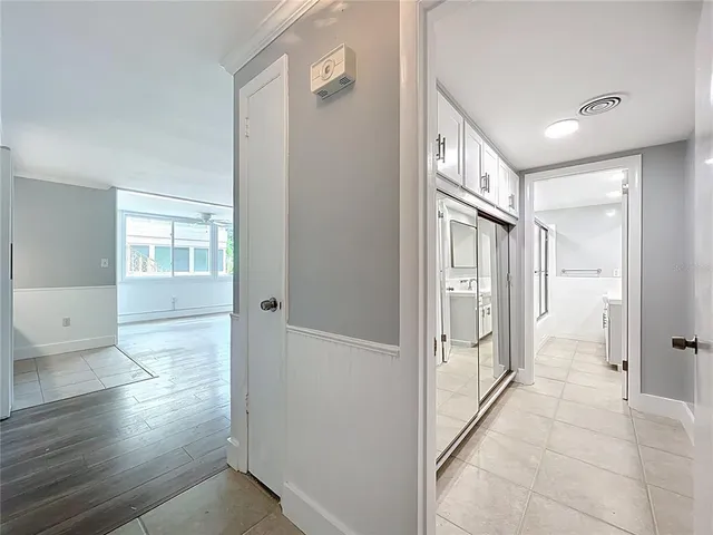 a bathroom with a glass door shower and a sink